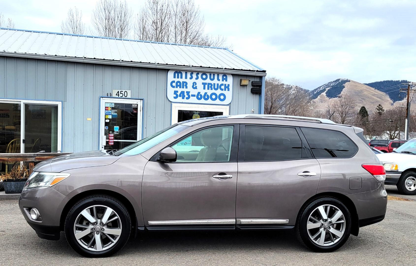 2013 Brown /Tan Nissan Pathfinder Platinum (5N1AR2MM1DC) with an 3.5L V6 engine, Automatic / CVT transmission, located at 450 N Russell, Missoula, MT, 59801, (406) 543-6600, 46.874496, -114.017433 - 4 Wheel Drive SUV. Power Sunroof. 3rd Row Seating. Heated Leather Front and Middle Seats. Power Front Seats. DVD Screens in Headrests. Navigation. Bluetooth. Backup Camera. AM FM CD DVD XM. Heated Steering Wheel. Towing. - Photo#0